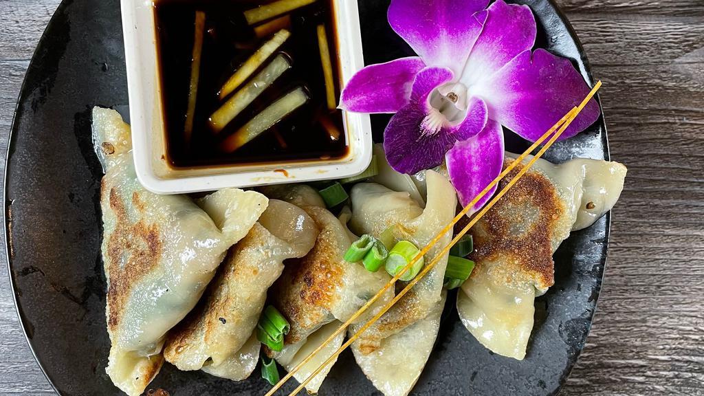 Mushroom Dumpling · Pan grilled dumpling, stuffed with shiitake mushroom, and chive, served with ginger sauce.
