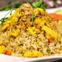 Crab Fried Rice · Stir fried rice with crab claw and shredded meat, egg, pea ,carrot, tomatoes, green onion, g...