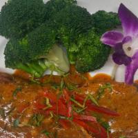 Choo Chee Salmon · Grilled salmon, red choo chee sauce, basil,  steamed broccoli and carrot.