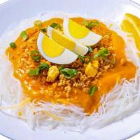 Pancit Palabok · Rice noodles, shrimp-garlic sauce, sauteéd ground pork, diced tofu, ground chicharon, choppe...