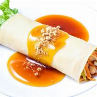 Fresh Lumpia · Crepe filled with sauteéd julienne green beans, carrots, tofu, bamboo shoots, topped with sw...