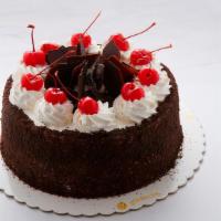 Black Forest Cake · Layers of chocolate chiffon cake filled with whipped cream and dark sweet cherries topped wi...