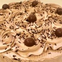 Chocolate Tres Leches Cake · Layers of chocolate chiffon cake soaked in three types of milk, filled and iced with chocola...