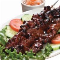 Pork Bbq · Grilled marinated pork skewer glazed with our special BBQ sauce. Serving for two to three.
