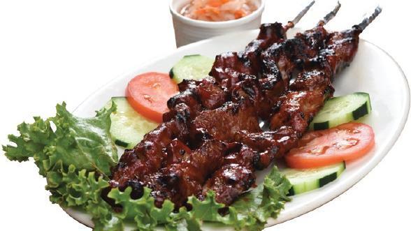 Pork Skewer Combo · 2 pieces of our Filipino-style skewered pork grilled and brushed with our special barbecue sauce and served with steamed rice & tangy sauerkraut salad.