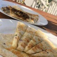 Quesadilla Signature Plate · Our signature plates offers the best of our menu in a box. Quesadilla and we add our delicio...