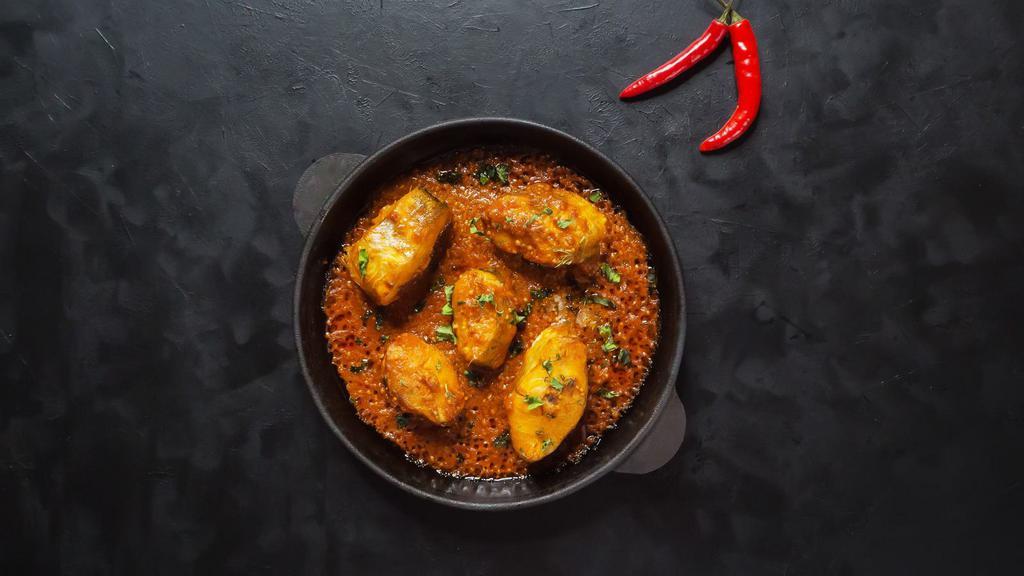 Fish Curry · Clay oven roasted fish cooked in a onion and tomato gravy.