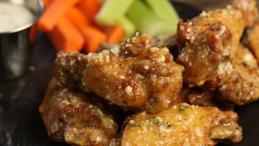 Traditional Garlic Parmesan Wings · 8 garlic parmesan wings (mild heat), served with carrots & celery and a choice of blue cheese, classic ranch, or sriracha ranch for dipping.