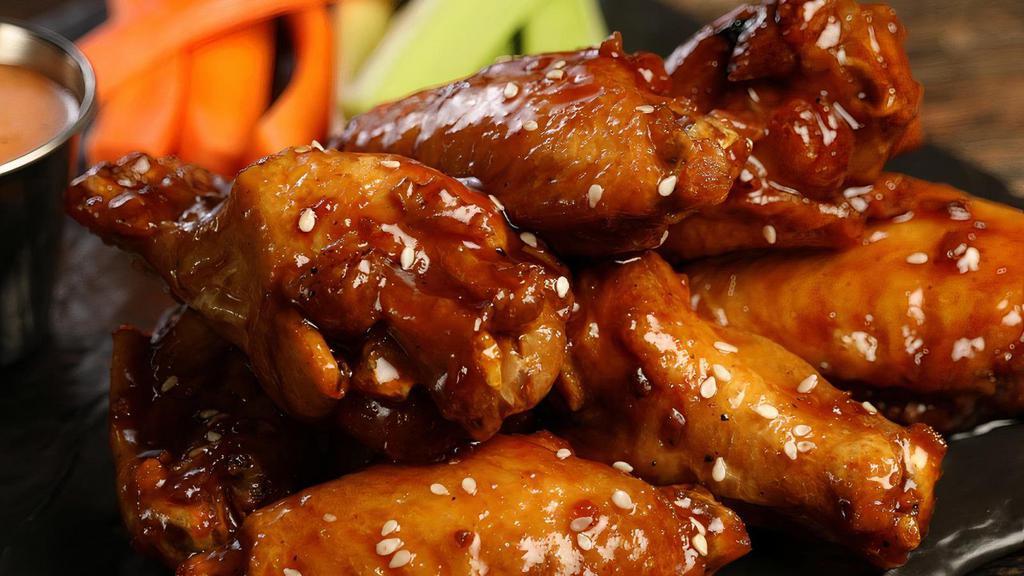 Korean Bbq Wings · Mild heat 8 pieces Korean BBQ wings. Comes with classic style bone-in or boneless wings, carrots & celery, and choice of blue cheese or ranch for dipping.