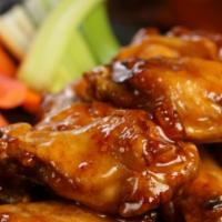 Traditional Hot Honey · 8 hot honey wings (medium heat), served with a choice of blue cheese or classic ranch for di...