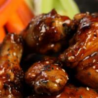 Traditional Teriyaki Wings · Eight pieces of teriyaki smoked and grilled wings (mild heat).