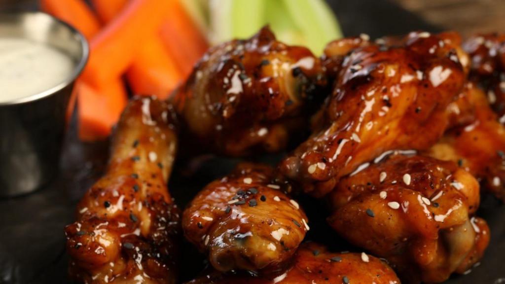 Traditional Teriyaki Wings · Eight pieces of teriyaki smoked and grilled wings (mild heat).