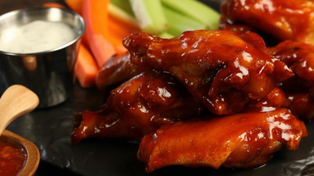 Sweet Chili Wings · 8 pieces of sweet chili wings (mild heat), served with carrots and celery and a choice of blue cheese, or classic ranch
