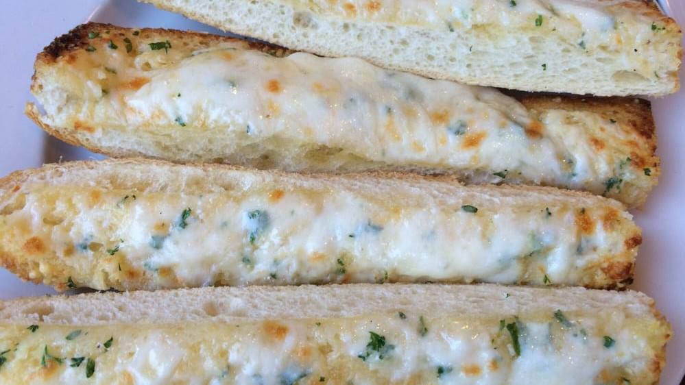 Garlic Bread · Butter, cheese, fresh garlic, and parsley.
