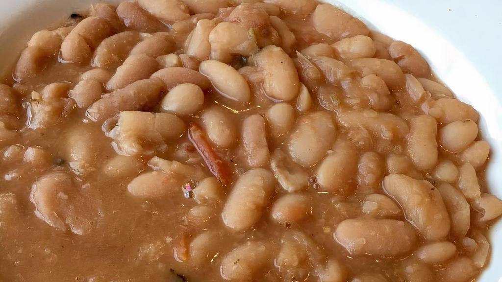 Tuscan-Style Cannellini Beans · With garlic, sage, and tomatoes.