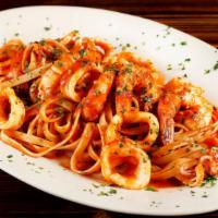 Linguine Allo Scoglio · Linguini noodle sauté with prawns, mussels, manila clams, calamari in a lightly spice tomato...