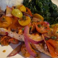 Salmone Alla Capocaccia · Roasted wild salmon, organic cherry tomatoes, calamata olives, capers, raw red onions in a l...