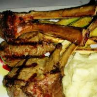 Agnello Ai Mirtilli · Grilled racks of lamb served with blueberry sauce, served with roasted red potatoes and saut...