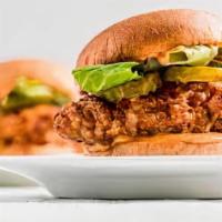 CHICKEN SANDWICH · Fried chicken layered with jalapeno coleslaw served on a toasted roll
