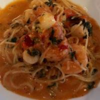 SEAFOOD PASTA · Angel hair pasta, tomato, basil, scallops, shrimp, and a touch of cream