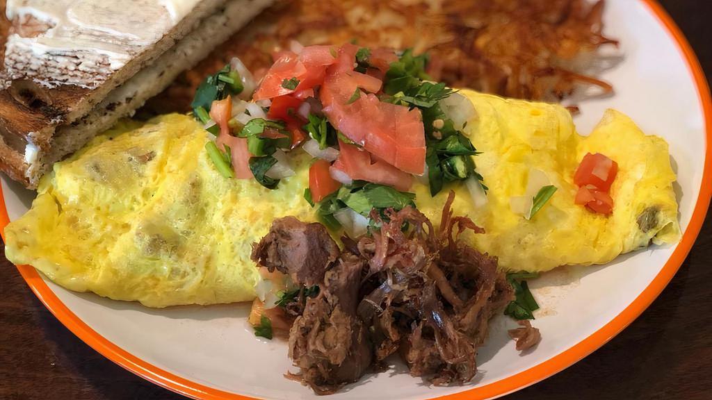 Carnitas Omelet · Three-egg omelet filled with pork carnitas and pepper jack cheese, topped with salsa fresca. Served with all star potatoes or hash browns & toast.