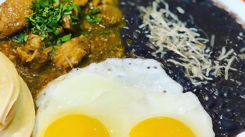 Ernesto's Authentic Mexican Chile Verde · With chunks of pork shoulder slow-cooked in a roasted tomatillo and cilantro jalapeño serrano sauce, served with two eggs and potatoes or refried black beans and three tortillas.