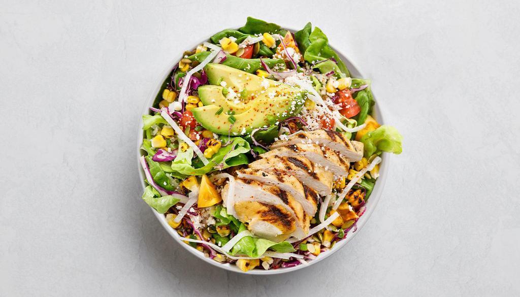 ELOTE · butter lettuce, cabbage, grilled chicken, grilled corn, cherry tomatoes, cotija cheese, avocado, pumpkin seeds, jicama, scallions, tajin, lime crema dressing    *We can't guarantee items are allergen free