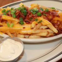 Irish Nacho Fries · French fries topped with melted cheddar cheese, crispy bacon bits and green onions.