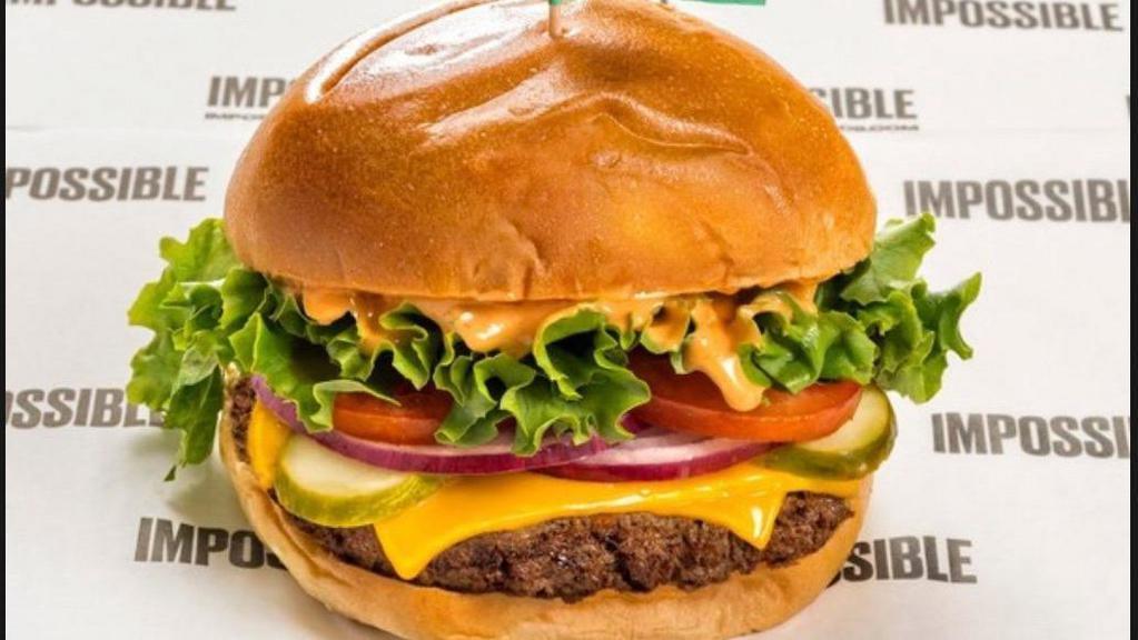 Impossible Burger · Vegetarian. The impossible patty made entirely from plants, sea salt, and black pepper, iceberg lettuce, kosher dill pickle, red onions, tomatoes, prime burger sauce. Add cheese, fries, potato, onion, bacon, avocado, patty, egg   for an additional charge.