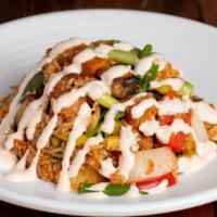 Chaufa Pork Belly · Peruvian fried rice, pork belly, scrambled eggs, asparagus, hoisin and aji amarillo, and wil...