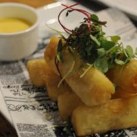 Yucca Fries · With huancaina sauce and queso rayado.