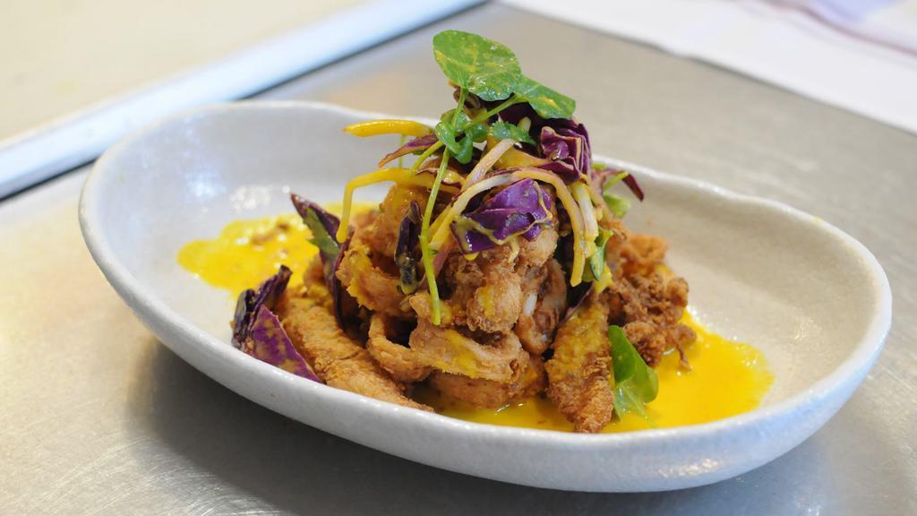 Chicharrones · Fried and crispy, marinated in our special sauce, with rocoto aioli and lemon.