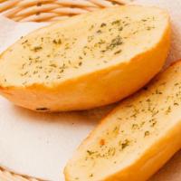 Pesto Garlic Bread · Toasted bread topped with garlic pesto, and mozzarella cheese