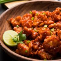 Gobi Manchurian Chow Mein · Fresh cauliflower florets tossed in a spicy, sweet and tangy manchurian sauce sitting on a b...