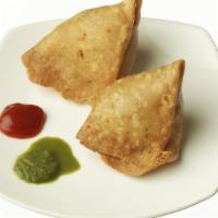 Samosa (2 Pcs.) · A special dough pastry stuffed with potatoes and peas with five spice flavors.