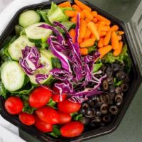 Garden Salad · Fresh, mixed green salad with mushrooms, tomatoes, cucumbers, carrots, and our own garlic pa...