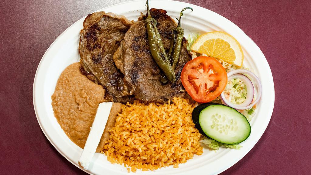 Carne Asada · Served with rice, beans, salad y tortillas.