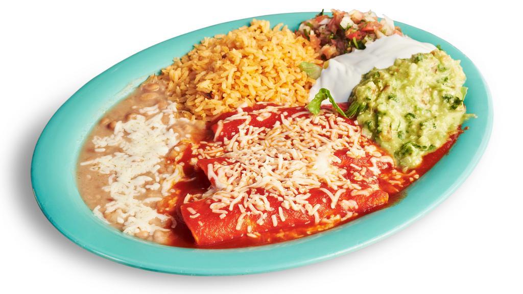 Cheese Enchilada Dinner · Three cheese enchiladas served with rice, beans, guacamole, cheese, sour cream, lettuce, and salsa.