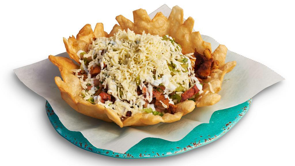 Taco Salad · A fried tortilla shell bowl, with your choice of meat, rice, beans, salsa, cheese, sour cream, lettuce, and guacamole.