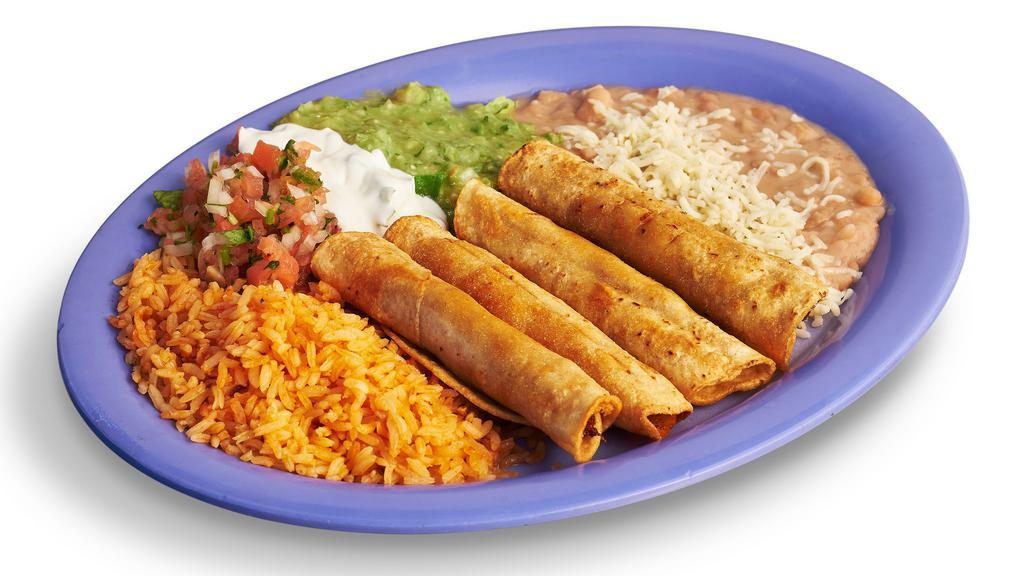 Chicken Flautas Plate · Four chicken flautas complemented with rice, beans, guacamole, salsa, sour cream, cheese, and tortillas.