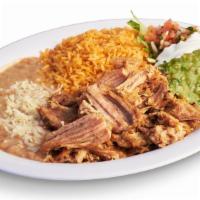 Carnitas Plate · Fried pork. Includes rice, beans, guacamole, salsa, sour cream, cheese, and tortillas.