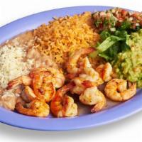 Camarones al Mojo de Ajo Plate · Garlic shrimp. Includes rice, beans, guacamole, salsa, sour cream, cheese, and tortillas.