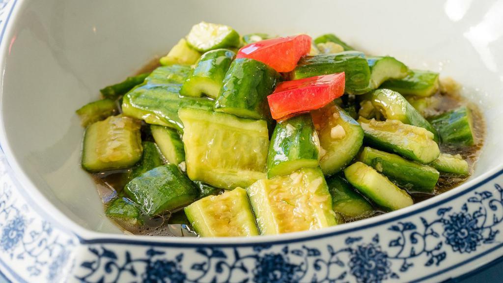 Garlic Cucumber · Vegetarian. Cucumber with garlic and garnished with bell pepper.