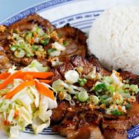 Hong Kong Pork Chop · Steam rice with lemongrass flavored pork chops, sweet & sour cabbage, garlic, and scallion.