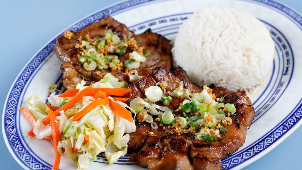 Hong Kong Pork Chop · Steam rice with lemongrass flavored pork chops, sweet & sour cabbage, garlic, and scallion.