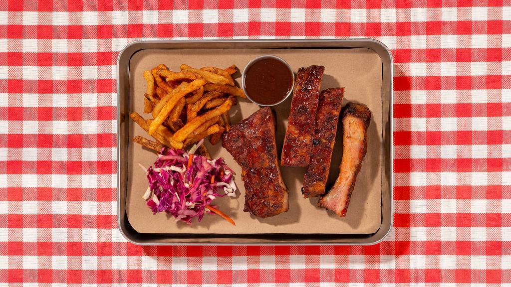Bbq Smoked Pork Ribs · House smoked pork ribs served with your choice of 2 signature sides.