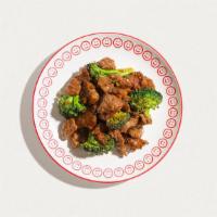 Beef And Broccoli · Tender beef, broccoli, carrots, wok-tossed in a garlic-ginger soy sauce. Served with white r...