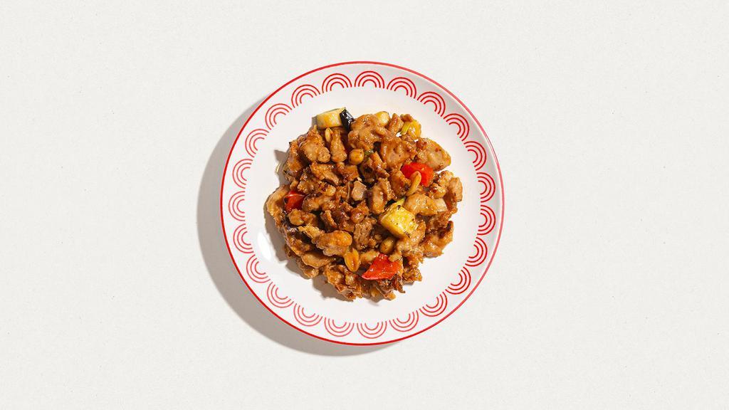 Kung Pao Chicken · New York Style - chicken wok-tossed with scallions, sun-dried chili peppers, peanuts in a sweet red mandarin sauce. Served with white rice.