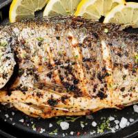 Pompano Fish · Fresh fish stuffed with lime and fried whole seasoned with soy sauce, seasonings and fresh g...