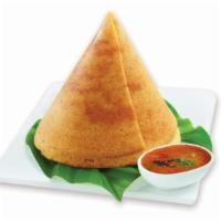 Ghee Dosa · A fresh made thin Indian crepe made from a fermented batter of lentils and rice, topped with...